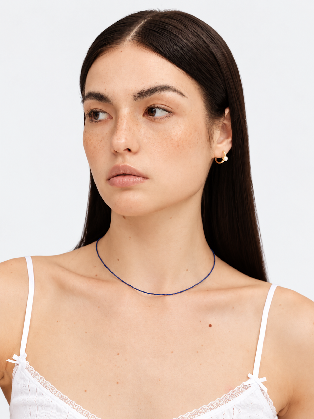Lapis Lazuli Ultra Slim Necklace featuring delicate 1 mm genuine lapis lazuli beads in a minimalist royal-blue strand with gold-plated details.