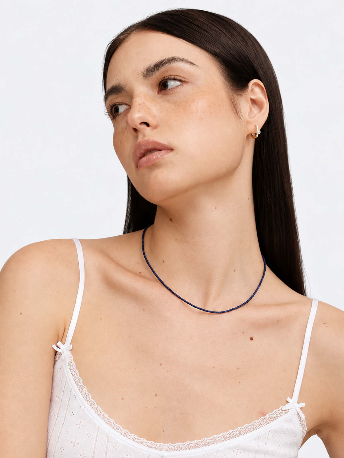 Lapis Lazuli Ultra Slim Necklace featuring delicate 1 mm genuine lapis lazuli beads in a minimalist royal-blue strand with gold-plated details.