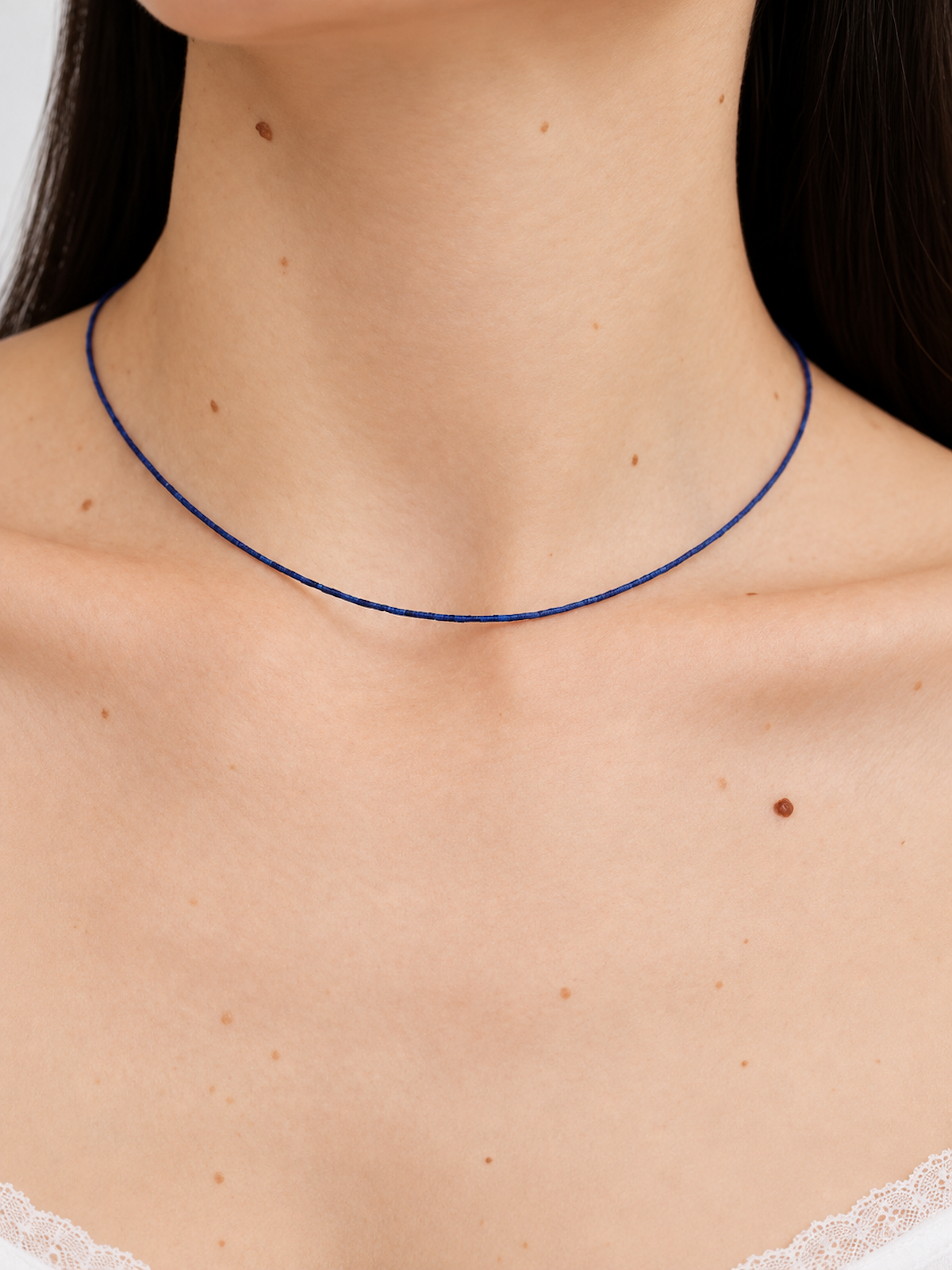 Lapis Lazuli Ultra Slim Necklace featuring delicate 1 mm genuine lapis lazuli beads in a minimalist royal-blue strand with gold-plated details.