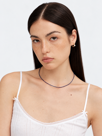 Lapis Lazuli Ultra Slim Necklace featuring delicate 1 mm genuine lapis lazuli beads in a minimalist royal-blue strand with gold-plated details.