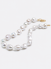 One-of-a-kind baroque pearl statement necklace featuring large irregular genuine freshwater pearls with naturally unique shapes and a gold vermeil closure.