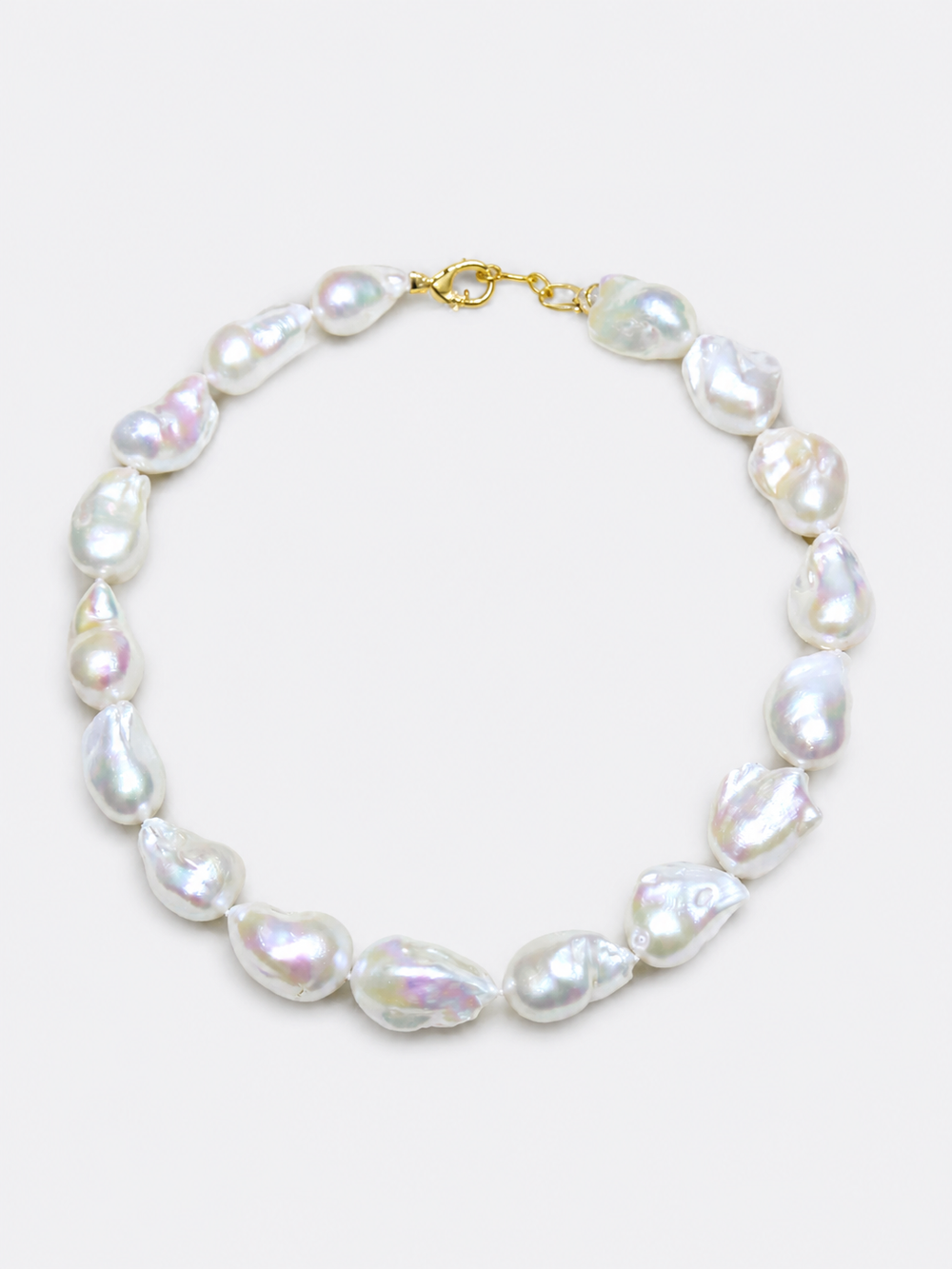 One-of-a-kind baroque pearl statement necklace featuring large irregular genuine freshwater pearls with naturally unique shapes and a gold vermeil closure.