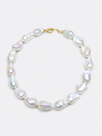 One-of-a-kind baroque pearl statement necklace featuring large irregular genuine freshwater pearls with naturally unique shapes and a gold vermeil closure.