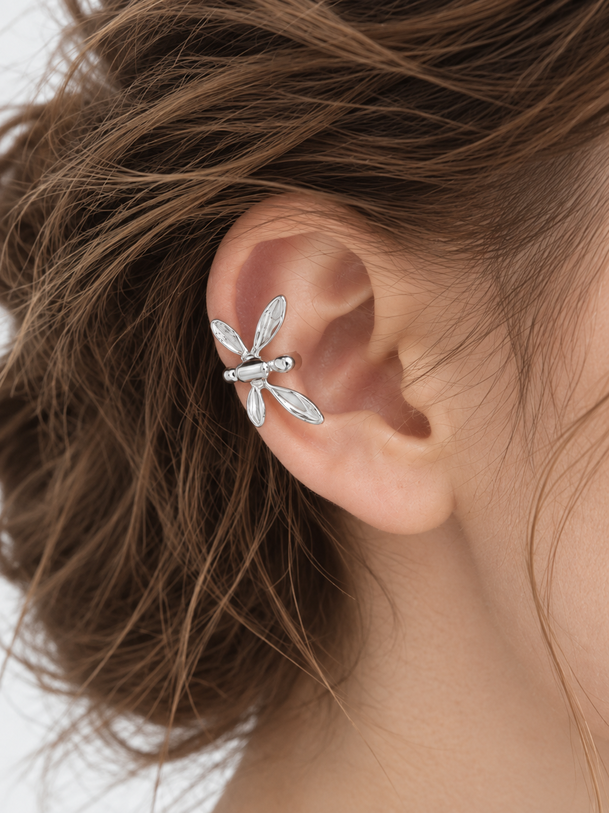 Dragonfly Wraparound Cartilage Ear Cuff with dimensional wings, available in gold and silver finishes.