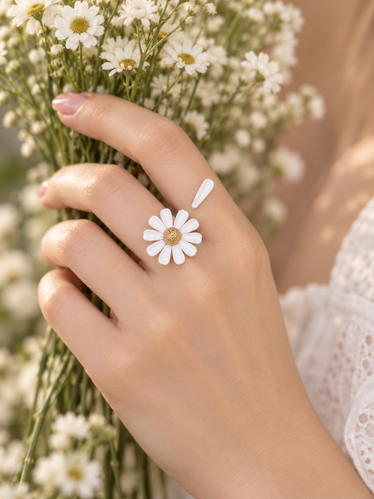 Luminous white daisy flower open ring with textured centre and delicate asymmetrical petal design.