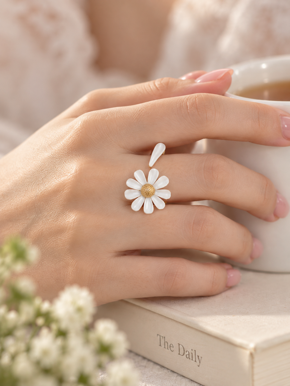 Luminous white daisy flower open ring with textured centre and delicate asymmetrical petal design.
