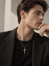 Refined tapered moissanite cross pendant necklace with elongated pointed design and delicate fine chain.