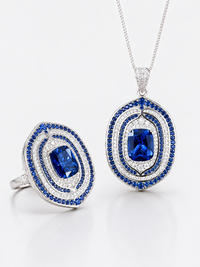Shop the Royal Sapphire Halo Crystal Pendant with a deep sapphire-blue centre crystal, layered sparkling halos and white gold-plated finish.