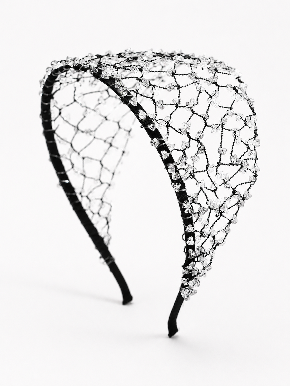 Wide black hairband with an intricate woven web design embellished with scattered clear crystal beads.