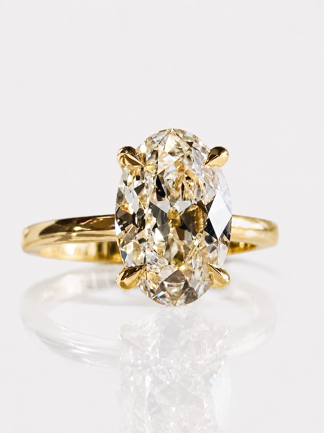 Dazzling 5CT Pigeon Egg Oval Stone Ring featuring a large oval-cut premium zirconia in a gold-plated adjustable solitaire-inspired setting.
