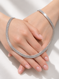 Ultra Shiny Layered Herringbone Chain Necklace featuring layered 7 mm herringbone chains with a highly polished finish in gold and silver-tone options.
