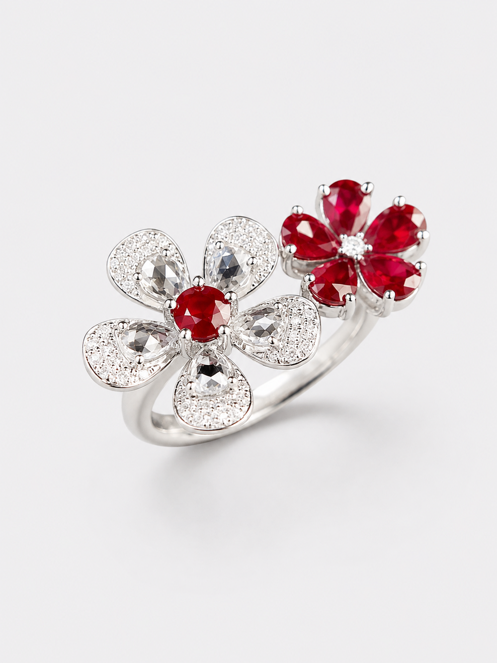 Ruby Plum Blossom Ring featuring ruby-colored and clear crystal plum blossoms on a white gold-plated adjustable band.