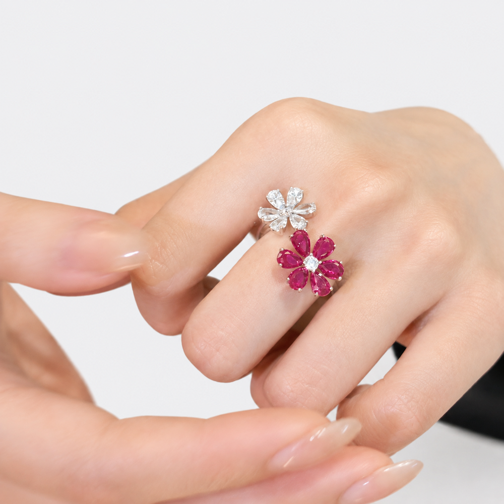 Ruby Plum Blossom Ring featuring ruby-colored and clear crystal plum blossoms on a white gold-plated adjustable band.