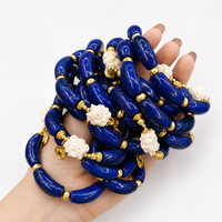 Imperial Lapis Lazuli Guardian Bracelet featuring genuine curved lapis lazuli beads, a hand-carved guardian bead, and gold vermeil accents in a handcrafted vintage-inspired design.
