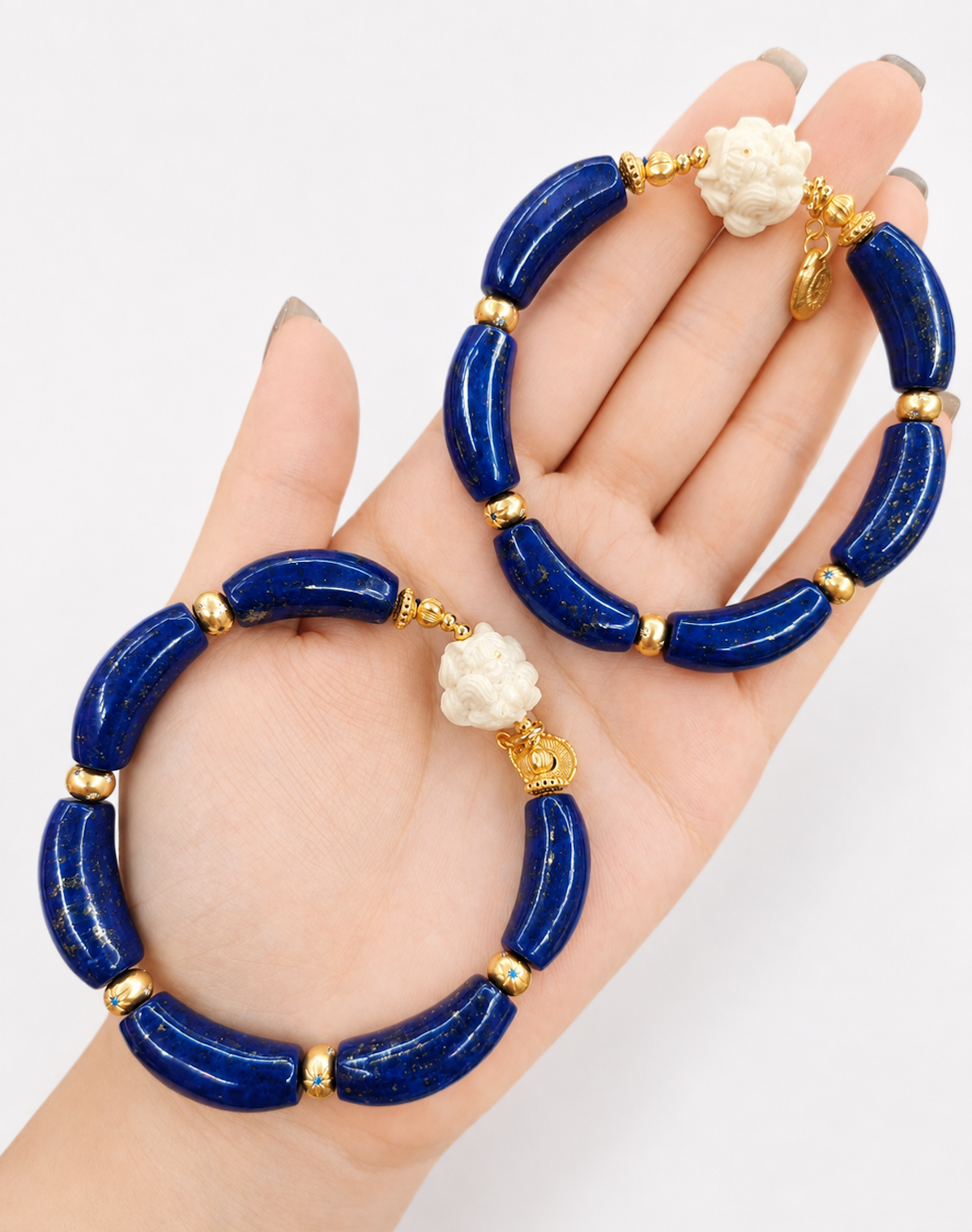 Imperial Lapis Lazuli Guardian Bracelet featuring genuine curved lapis lazuli beads, a hand-carved guardian bead, and gold vermeil accents in a handcrafted vintage-inspired design.
