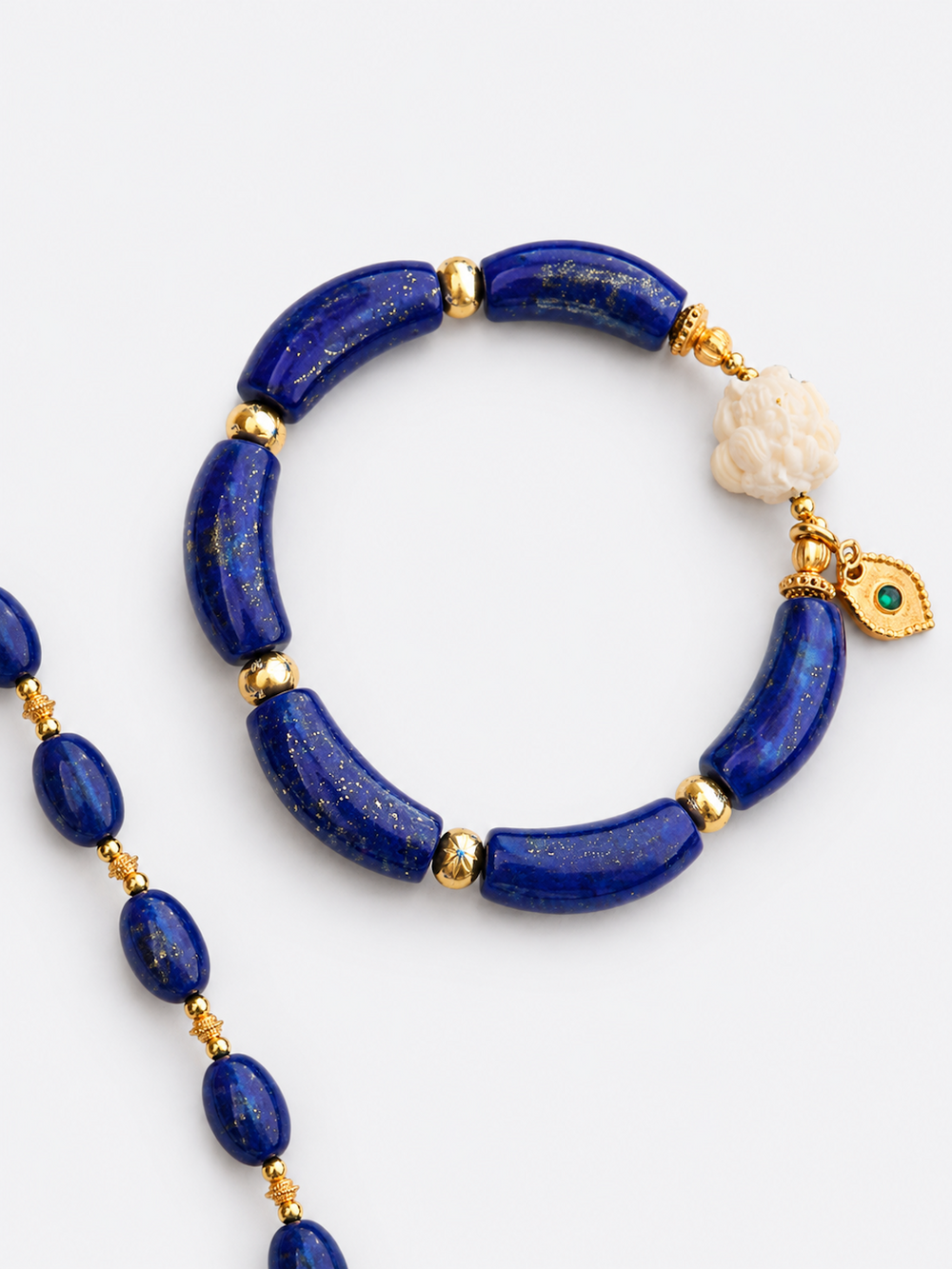Imperial Lapis Lazuli Guardian Bracelet featuring genuine curved lapis lazuli beads, a hand-carved guardian bead, and gold vermeil accents in a handcrafted vintage-inspired design.
