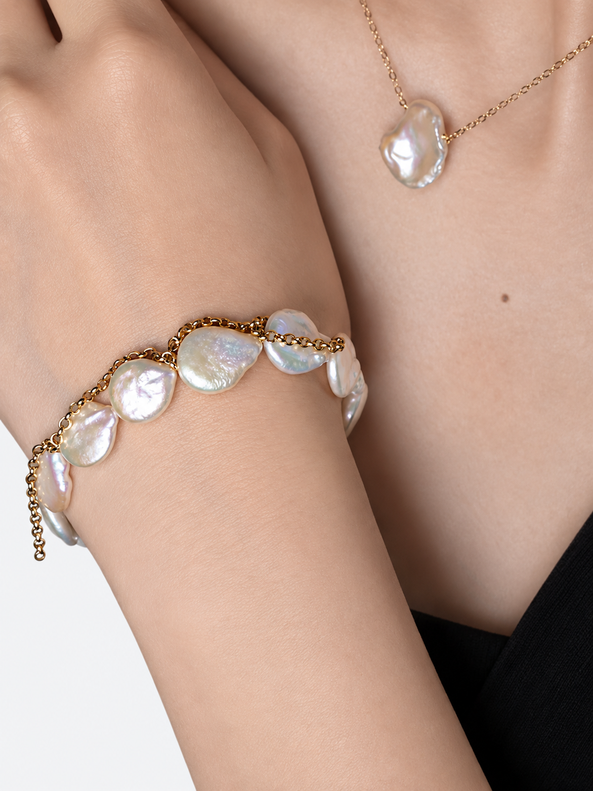 Luminous Baroque Pearl Coin Beads Bracelet with irregular freshwater baroque pearls and delicate golden chain details.