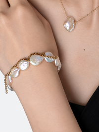 Luminous Baroque Pearl Coin Beads Bracelet with irregular freshwater baroque pearls and delicate golden chain details.