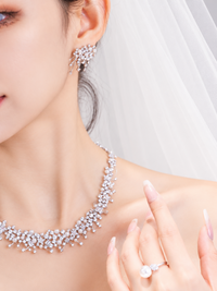 Starlight Pearl Bridal Jewelry Set featuring a matching necklace and earrings with luminous pearls and sparkling premium-grade zirconia accents.