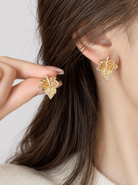 Autumn Ember Crystal Maple Leaf Earrings with layered amber and golden yellow crystals and sparkling leaf details.