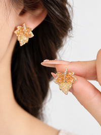Autumn Ember Crystal Maple Leaf Earrings with layered amber and golden yellow crystals and sparkling leaf details.