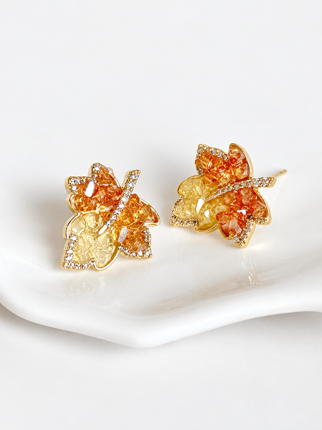 Autumn Ember Crystal Maple Leaf Earrings with layered amber and golden yellow crystals and sparkling leaf details.