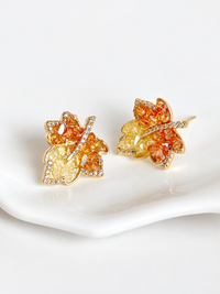 Autumn Ember Crystal Maple Leaf Earrings with layered amber and golden yellow crystals and sparkling leaf details.