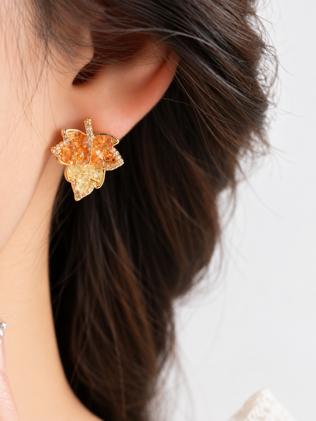 Autumn Ember Crystal Maple Leaf Earrings with layered amber and golden yellow crystals and sparkling leaf details.