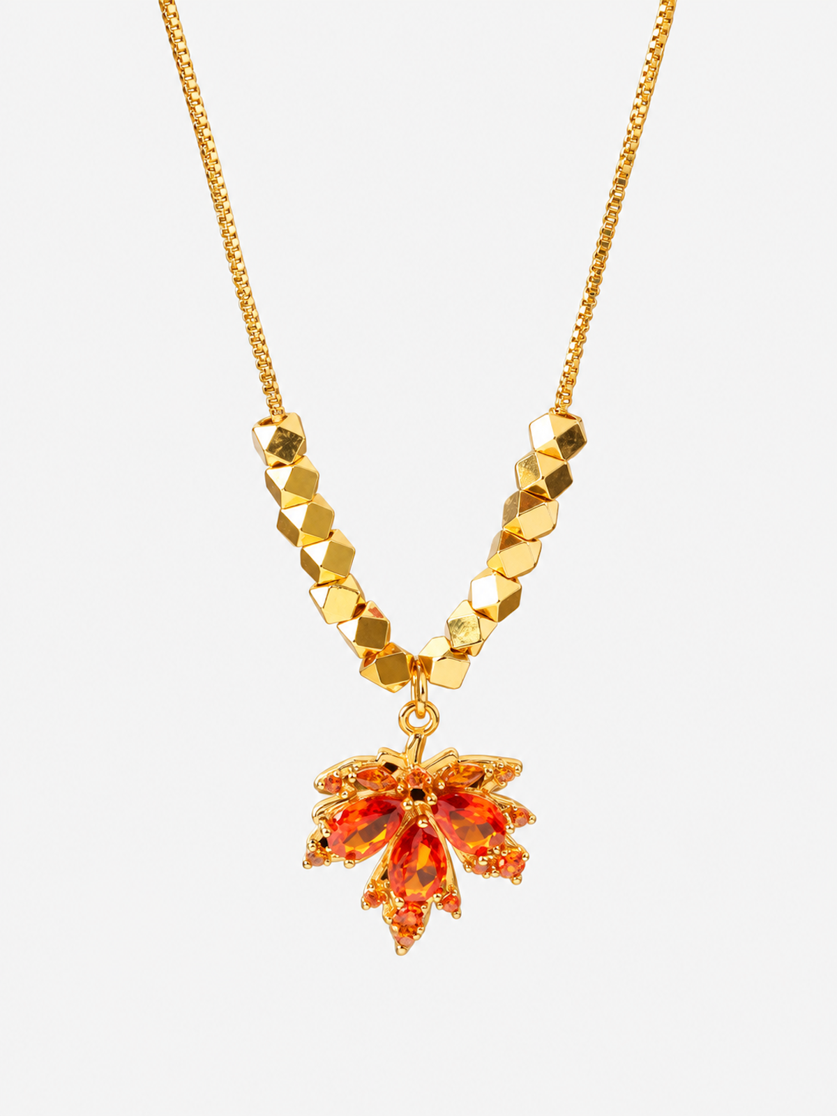 Fiery Orange Crystal Maple Leaf Necklace with orange crystal leaf pendant, faceted golden beads and delicate gold-plated chain.