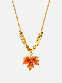 Fiery Orange Crystal Maple Leaf Necklace with orange crystal leaf pendant, faceted golden beads and delicate gold-plated chain.