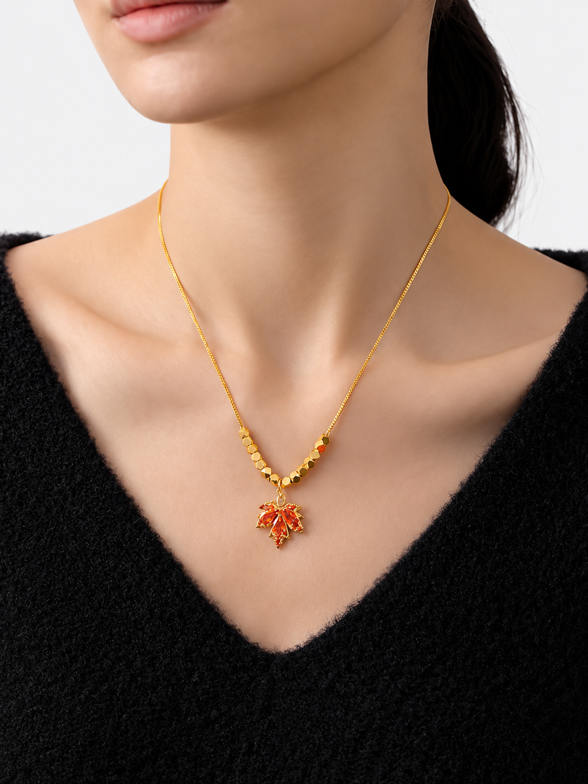 Fiery Orange Crystal Maple Leaf Necklace with orange crystal leaf pendant, faceted golden beads and delicate gold-plated chain.