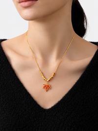 Fiery Orange Crystal Maple Leaf Necklace with orange crystal leaf pendant, faceted golden beads and delicate gold-plated chain.