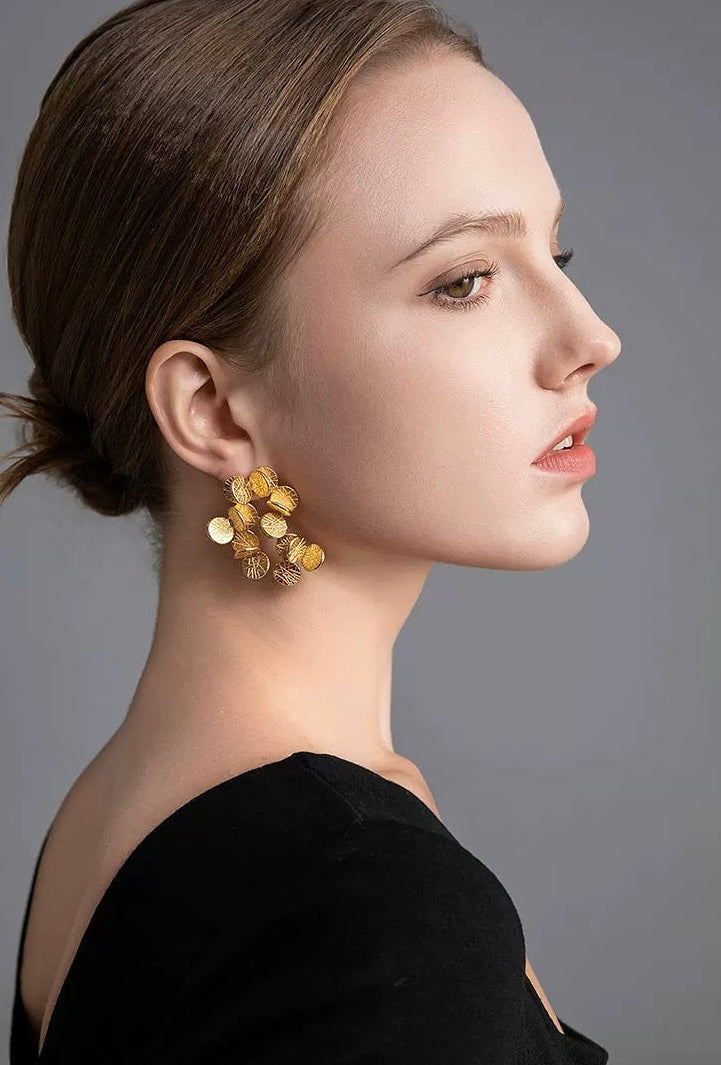 Golden Petal Bouquet Earrings featuring textured gold-plated cascading petals arranged in a sculptural bouquet-inspired drop design.