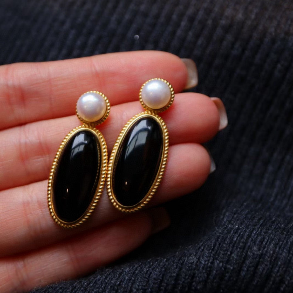 Heirloom black onyx pearl drop earrings crafted with genuine black onyx, freshwater pearls and gold vermeil.