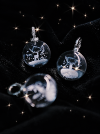 Clear Quartz Reindeer Necklace featuring a genuine clear quartz crystal pendant with a delicate reindeer motif suspended from a sterling silver chain.