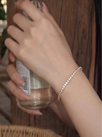 Timeless Diamond-Look Tennis Bracelet featuring a continuous row of premium-grade zirconia set in a classic gold-tone tennis bracelet design.