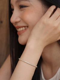 Timeless Diamond-Look Tennis Bracelet featuring a continuous row of premium-grade zirconia set in a classic gold-tone tennis bracelet design.