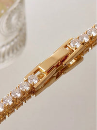 Timeless Diamond-Look Tennis Bracelet featuring a continuous row of premium-grade zirconia set in a classic gold-tone tennis bracelet design.