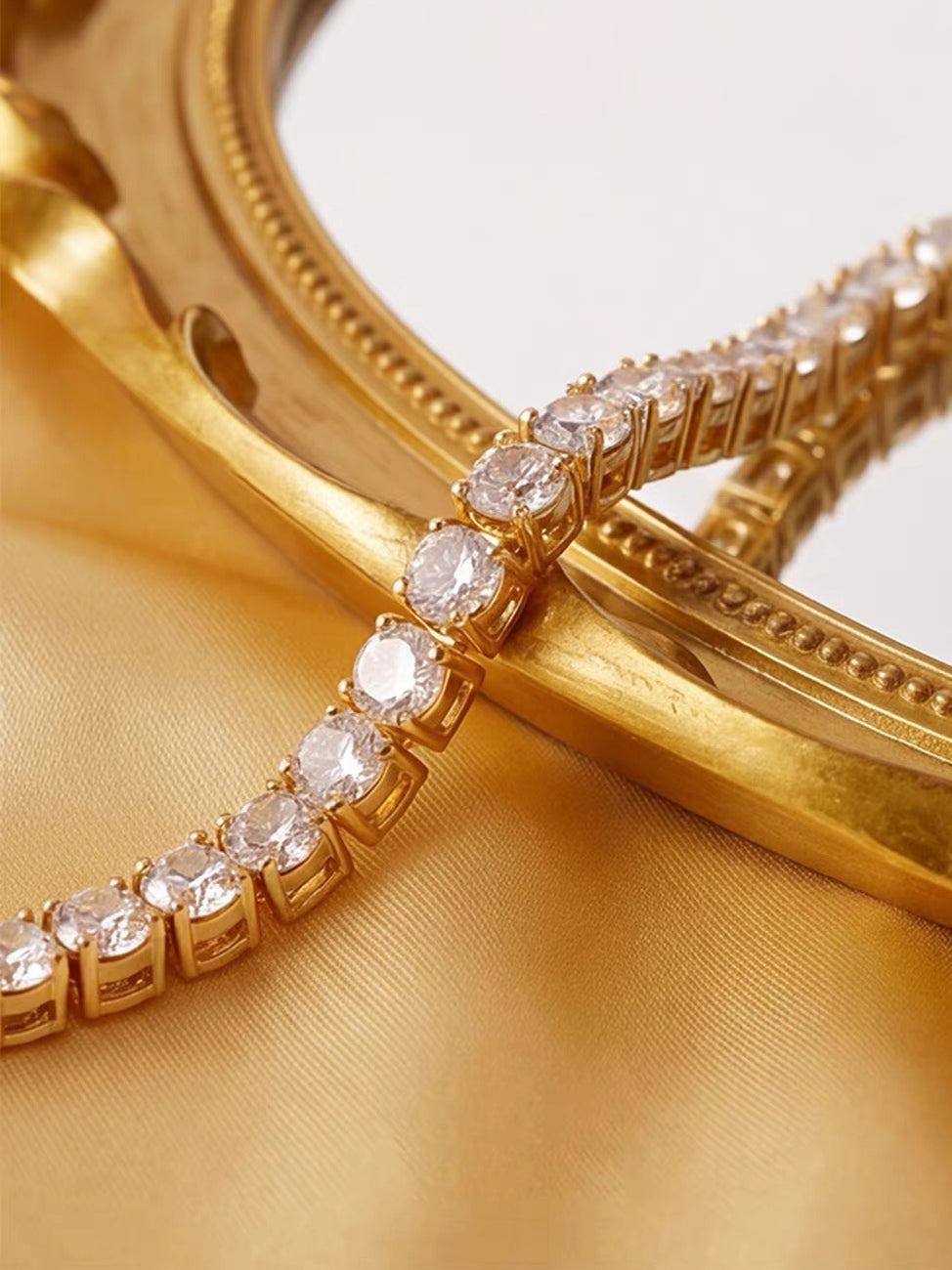Timeless Diamond-Look Tennis Bracelet featuring a continuous row of premium-grade zirconia set in a classic gold-tone tennis bracelet design.