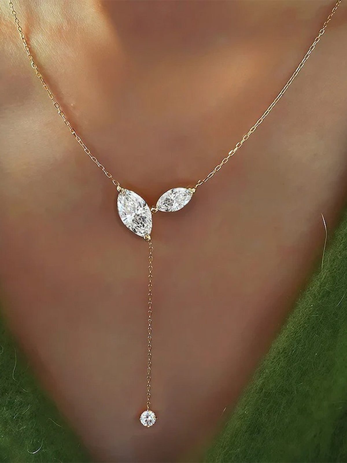 Poetic Three Petal Moissanite Flower Necklace with an asymmetric three-petal design and delicate cascading detail.