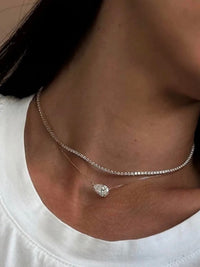 3CT pear cut moissanite solitaire necklace in 925 sterling silver with a delicate chain and minimalist setting.