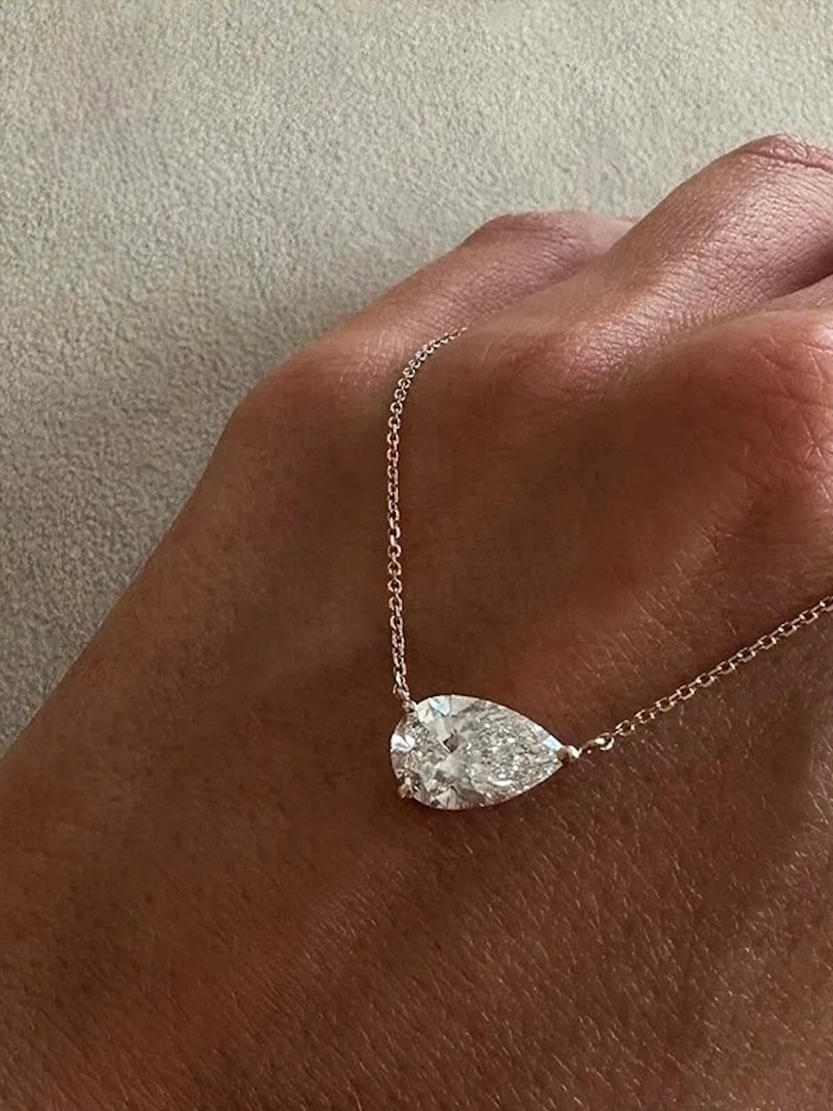3CT pear cut moissanite solitaire necklace in 925 sterling silver with a delicate chain and minimalist setting.
