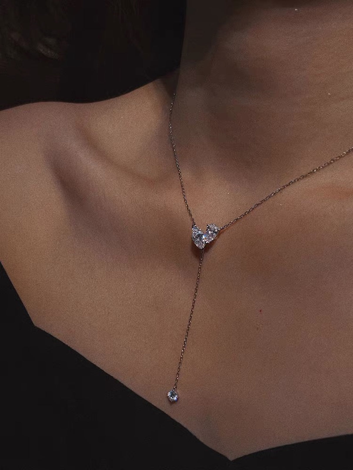 Poetic Three Petal Moissanite Flower Necklace with an asymmetric three-petal design and delicate cascading detail.