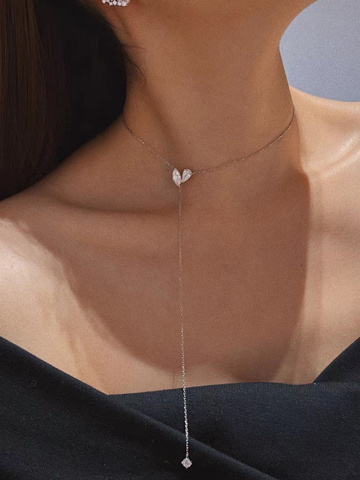 Poetic Three Petal Moissanite Flower Necklace with an asymmetric three-petal design and delicate cascading detail.