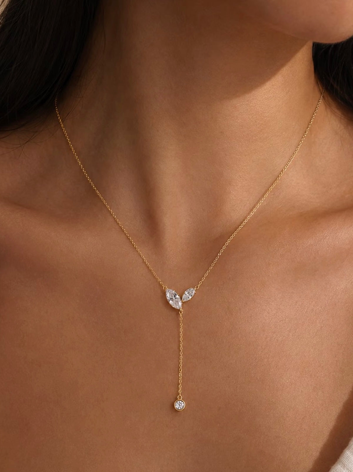 Poetic Three Petal Moissanite Flower Necklace with an asymmetric three-petal design and delicate cascading detail.