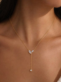 Poetic Three Petal Moissanite Flower Necklace with an asymmetric three-petal design and delicate cascading detail.