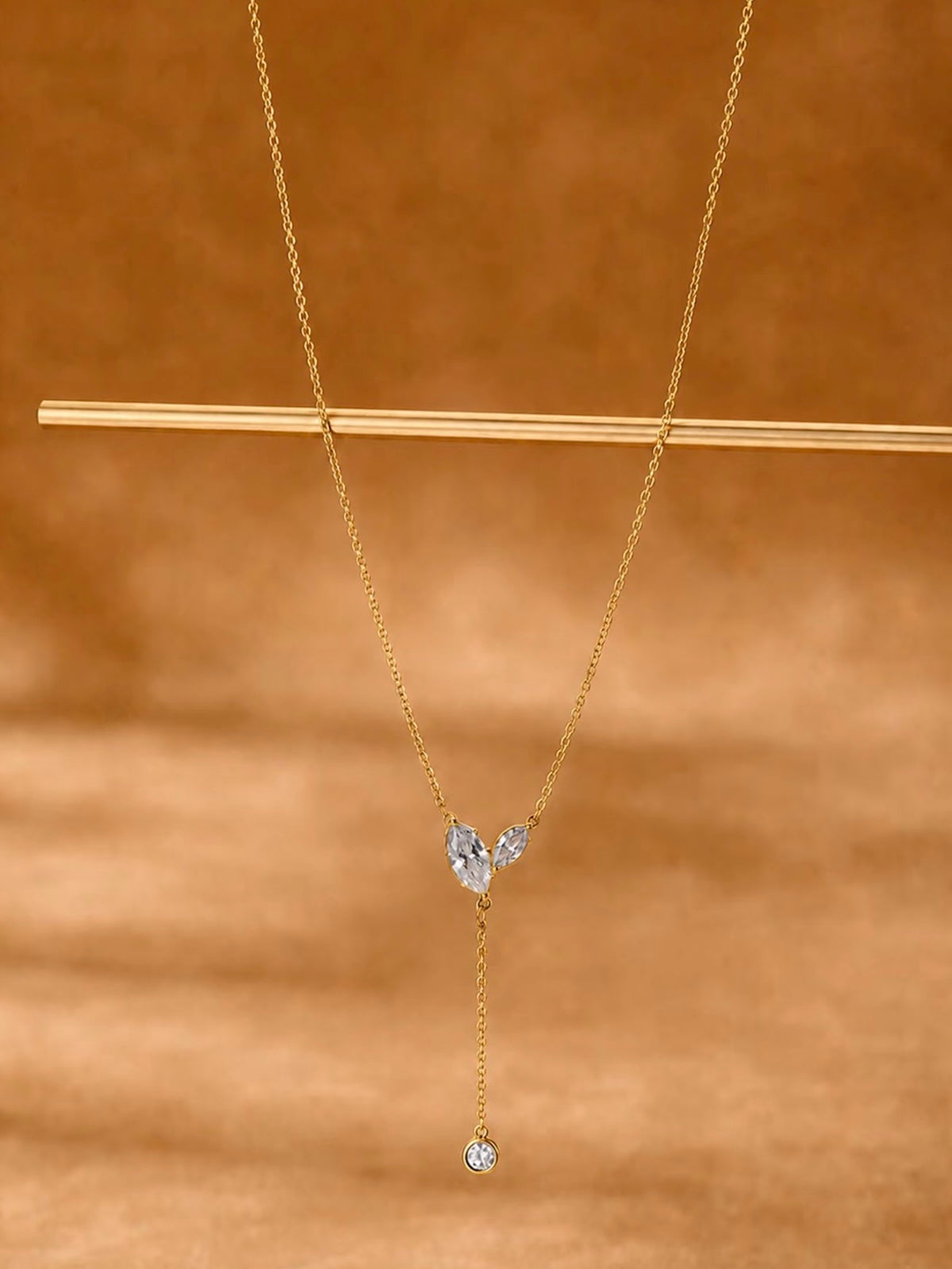 Poetic Three Petal Moissanite Flower Necklace with an asymmetric three-petal design and delicate cascading detail.