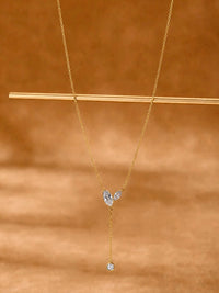 Poetic Three Petal Moissanite Flower Necklace with an asymmetric three-petal design and delicate cascading detail.