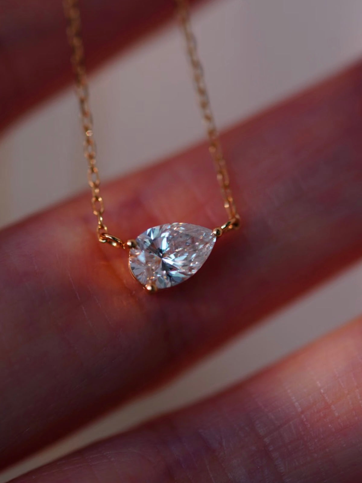 3CT pear cut moissanite solitaire necklace in 925 sterling silver with a delicate chain and minimalist setting.