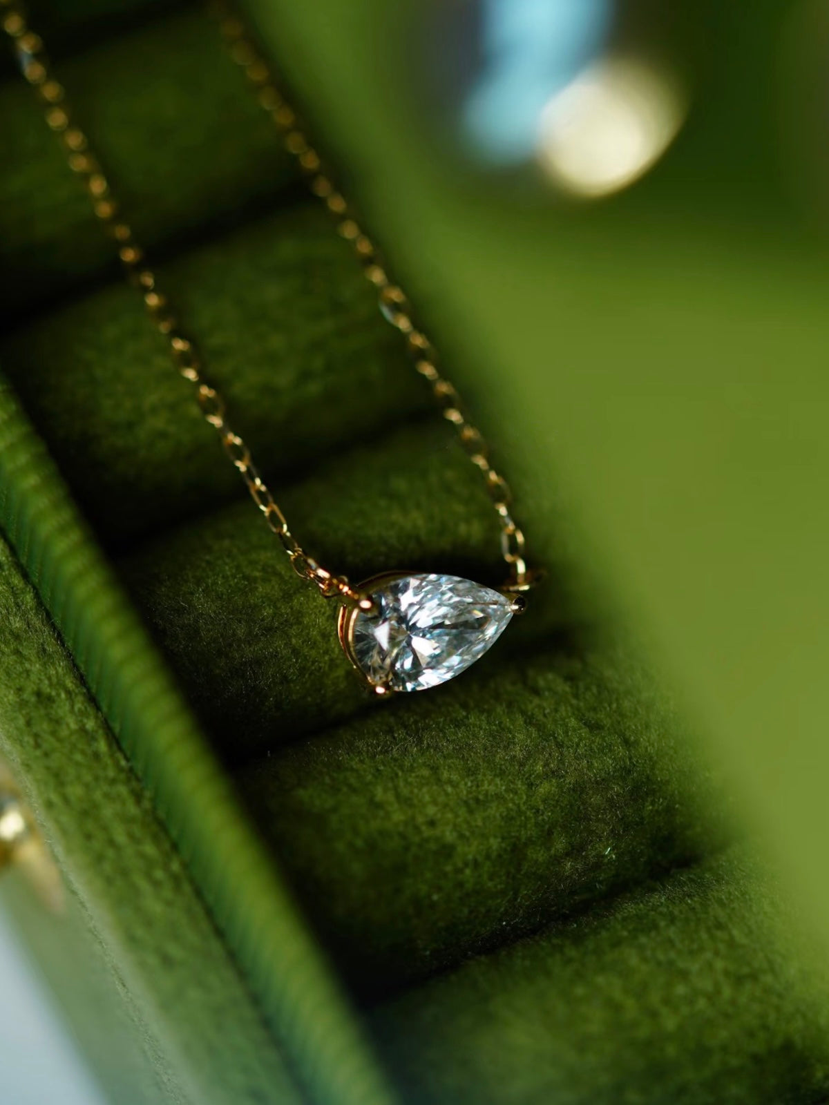 3CT pear cut moissanite solitaire necklace in 925 sterling silver with a delicate chain and minimalist setting.